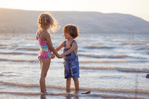 two young kids at the beach