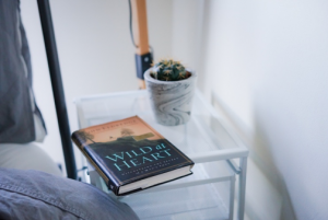 photo of a nightstand with a book