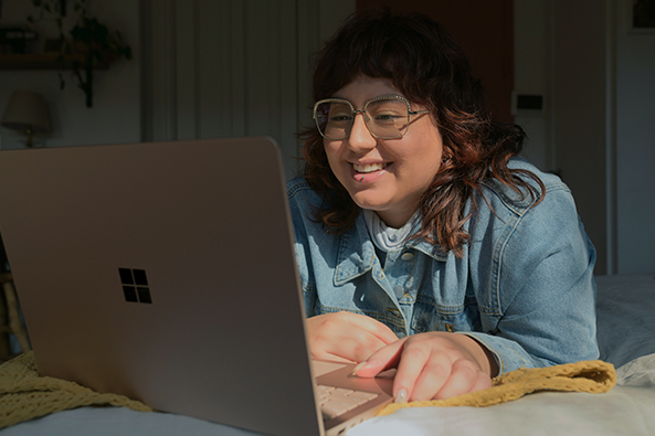 a person with a disability working from home on their laptop