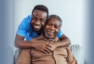 a man hugging an older relative