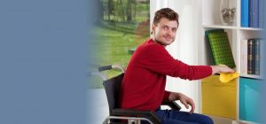 young man in wheelchair cleaning